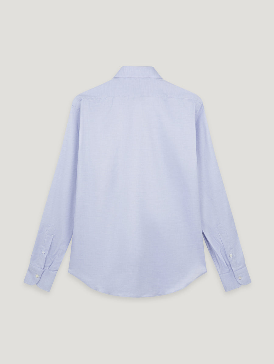 A light blue long-sleeve button-up shirt shown from the back, laid flat against a solid light gray background.
